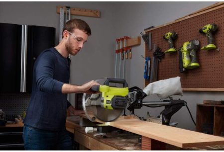 Man using Ryobi TSS103 Cutting Plank of Wood