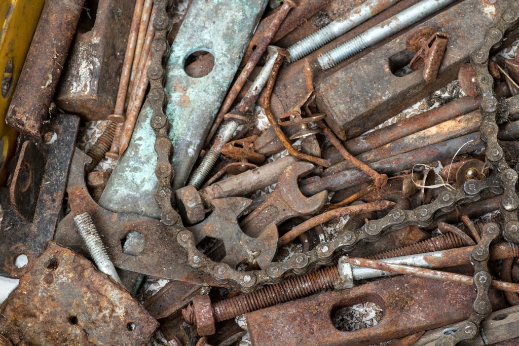 Rusty, neglected tools that have been thrown together.